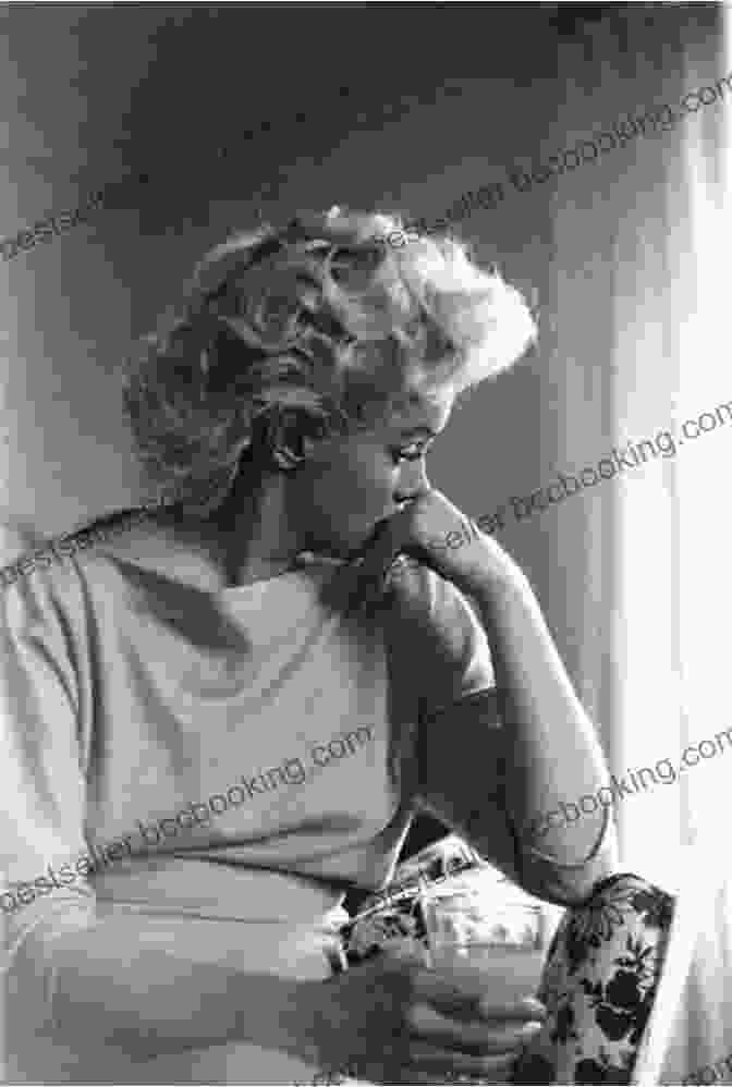 A Candid Photograph Of Marilyn Monroe, Capturing Her Vulnerability And Emotional Depth Marilyn Monroe: The Biography Donald Spoto