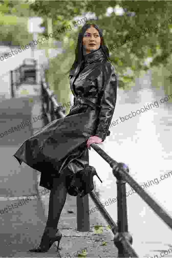A Woman Wearing A Long Black Coat Standing In The Rain. The Long Black Coat Diane Greenberg