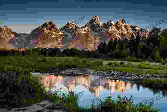 Grand Teton National Park, Where Jagged Peaks Mirror In The Glassy Waters Of Jackson Lake USA National Parks: Lands Of Wonder