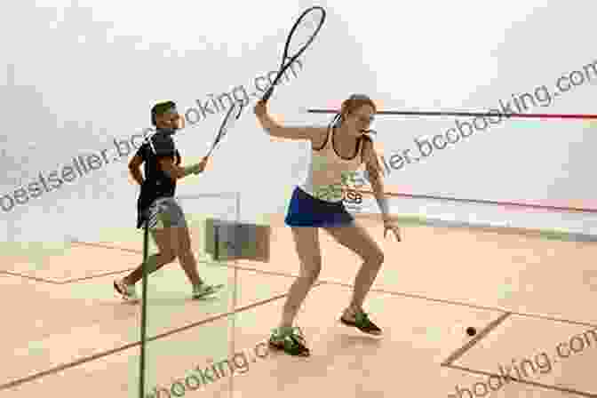 Squash Players Engaged In An Adrenaline Fueled Match Within A Confined Court Sports Racket: Amazing Racket Sport For You: Sports Racket Handbook