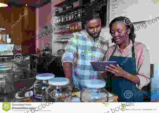Young Entrepreneur Working On A Laptop In A Cafe, Symbolizing The Entrepreneurial Opportunities Within Urban Communities The Collaborative City: Opportunities And Struggles For Blacks And Latinos In U S Cities (Contemporary Urban Affairs 8)